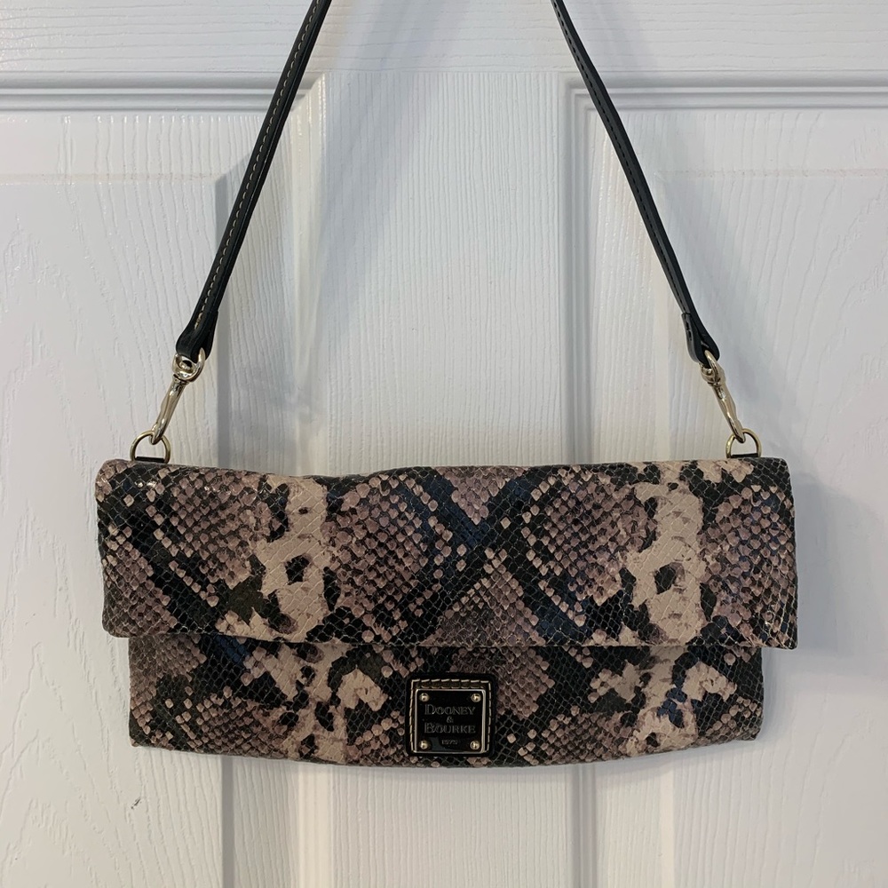 Dooney and Bourke fold over clutch with strap